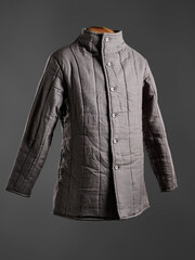 Historical fashion. Medieval knight cloth. Padded jacket gambeson.