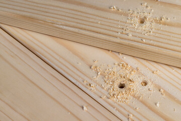 metal drill bit and pine wood board during operation
