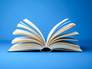 Naklejka premium Open book on blue background