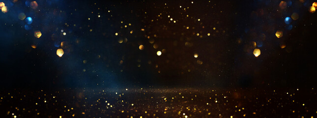 abstract glitter black, blue and gold lights background. de-focused