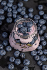 fresh cold yogurt with the taste and berries of ripe blueberries
