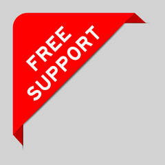 Red color of corner label banner with word free support on gray background