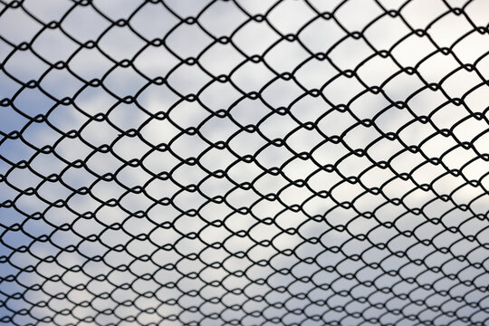 Chain link fence, Steel wire mesh with shallow focus.