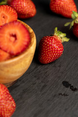 several pieces of red sweet strawberries in close-up
