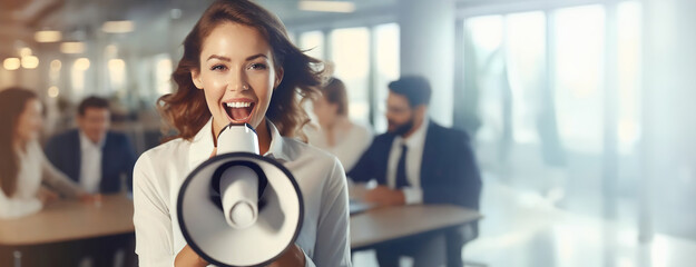 A businesswoman with a megaphone passionately speaking in an office environment as colleagues in the background observe