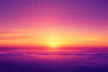 Obraz premium Sunset over clouds with vibrant hues. Use this image for backgrounds, websites, or designs.