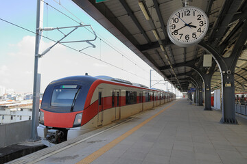 The red suburban train ready for service, Locomotive at platform inside railway station.