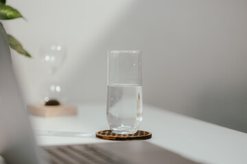 Minimalist Workspace with Glass of Water