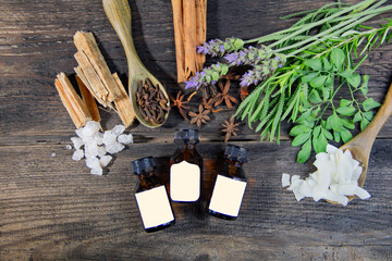 bottles of aromatic oils on rustic background