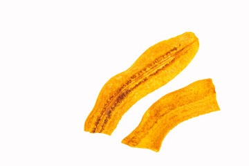 Musa x paradisiaca - Slices of fried plantain chips on white background. © Luis Echeverri Urrea