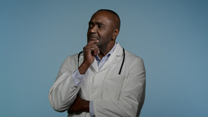 Thoughtful pensive African American man doctor male health care employee professional physician...