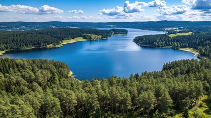 Serene Lake Surrounded by Lush Green Forests