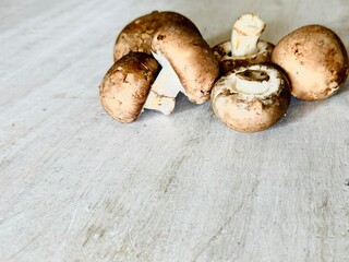 Fresh champignon mushrooms on the table.
