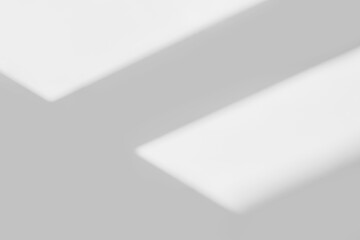 Abstract light reflection and grey shadow from window on white wall background. Gray window shadows and sunshine stripe diagonal geometric overlay effect for backdrop and mockup design