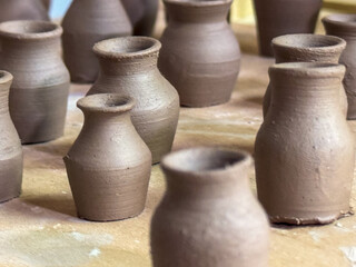 Miniature clay vases created during a ceramics masterclass. A fine example of craftsmanship and...