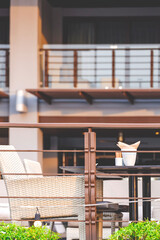 Dining table set in terrace area of modern hotel in vertical frame