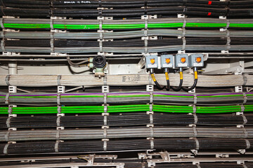 Line of installed industrial electrical cables.
