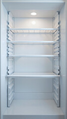 Empty refrigerator interior closeup.