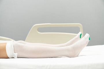 After surgery, pregnancy or varicose veins the patient is dressed in compression stockings by the...