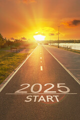 Sunrise New Year 2025 start beginnings. Start to 2025 is written on empty asphalt path with bright...