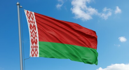 Belarusian national flag waving against blue sky.