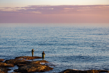 Fishermen on beach at sunset.  Antalya, Turkey