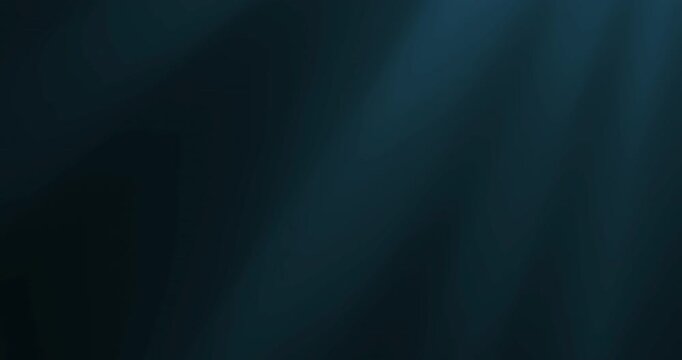 seamless loop of deep blue ocean waves from underwater background, light rays