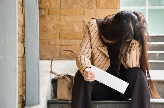 Homeless office worker face palming, getting indebted and bankrupt, concept for economic recession, lay off, joblessness, losing job, unemployment, debt, collection letter, no money concept