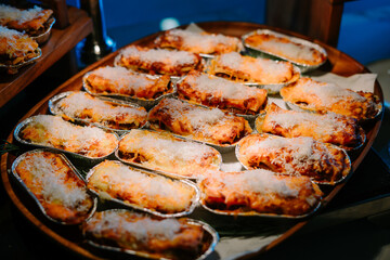 Mini lasagna servings arranged on a medium-sized tray