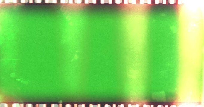film strip transition, with chroma key green screen background, effect of old film rolling with details, scratches and grain, vintage strip intro