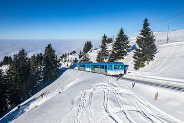 Rigibahn train climbing to the top of mount rigi