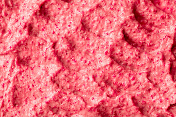 Fruit pink ice cream. Yogurt smoothie with fresh fruits and berries. Ice cream texture. Delicious sweet dessert close-up as background.