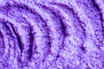 Lilac berry yogurt ice cream with blueberries, blackberries and bilberries. Fresh fruit and berry smoothie. Ice cream texture. Delicious sweet dessert close-up as background.