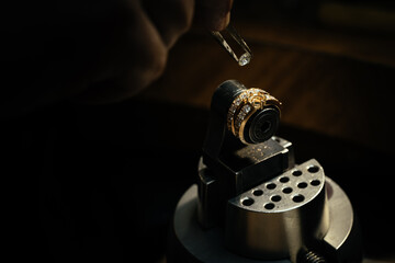 craftsman making diamond ring. hand made jewelry. Put diamond gem ring. diamond ring production....