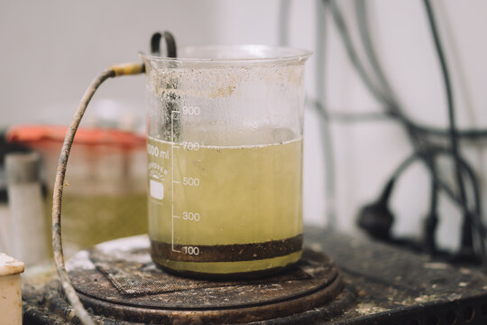 Nitric acid, hydrochloric acid, sulfuric acid, and their concentrations in decreasing order, in a beaker.