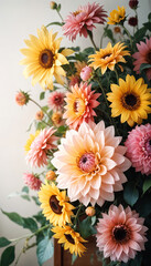 A vibrant bouquet of colorful flowers including yellow sunflowers, pink dahlias, and other assorted blooms against a soft background
