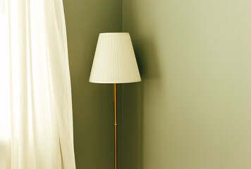 Floor lamp on a thin metal leg stands in the corner of the room near the curtains