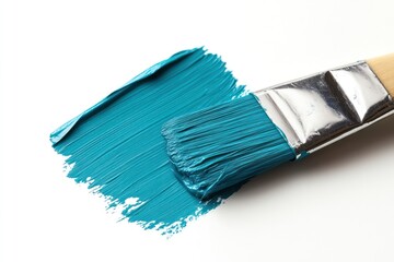 Paintbrush With Teal Paint on White Surface