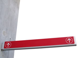 long direction sign with two white straight ahead direction arrows in round frame on grey concrete building corner isolated on transparent