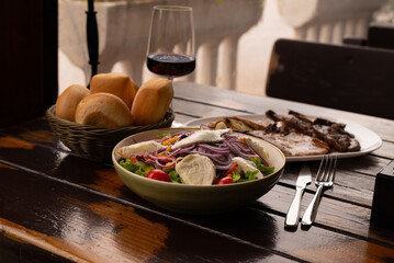 Rib fillet with salad red wine