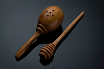 Wooden kitchen utensils on grey gradient background