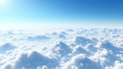 Fototapeta premium A serene view of fluffy clouds under a bright blue sky, evoking tranquility and openness.