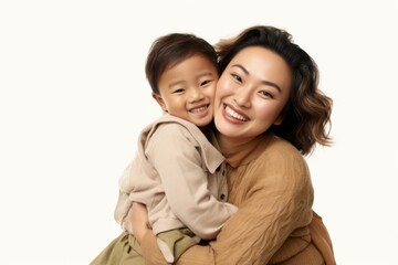 Laughing hugging adult women.