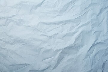 Obraz premium An old faded pastel blue paper backgrounds wrinkled textured.