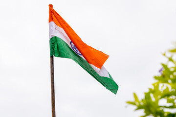 Waving Indian Tricolor Flag Against White Sky Background at Morning