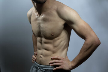 A young shirtless muscluar man