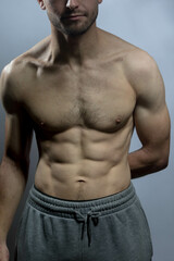 Obraz premium A young shirtless muscluar man