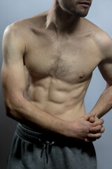 A young shirtless muscluar man