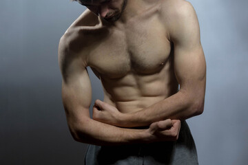 A young shirtless muscluar man
