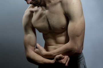 Fototapeta premium A young shirtless muscluar man